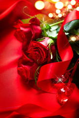 Poster - Valentine's Day red roses bouquet over silk background