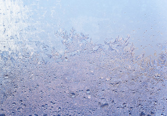 blue abstract background: drizzle on window