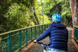 © twinsterphoto - Young man cycling in the forest trail in cold weather during weekend