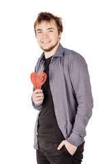 man holding a red heart on his hand isolated on a white backgrou