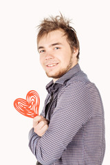 man holding a red heart on his hand isolated on a white backgrou