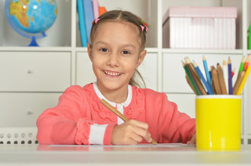 Wall Mural - little girl drawing at home
