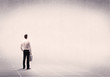 © ra2 studio - Business person standing in empty space