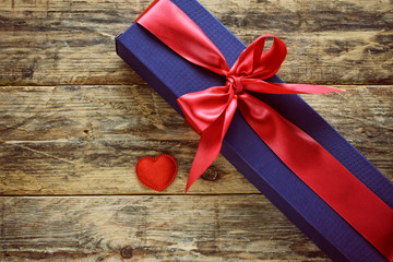 Wall Mural - blue gift box with red ribbon and heart