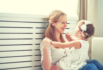 Poster - Happy loving family. mother and child playing,  kissing and hugg