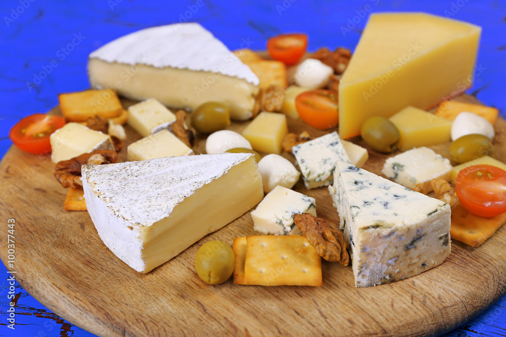 Cheese for tasting on cutting board