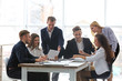 © Africa Studio - Young business people discussing a new project at the meeting in office