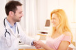 © Production Perig - Young attractive doctor shaking hand of his patient