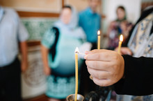 Burning Thin Candle During Christening
