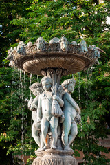 Wall Mural - Garden water fountain with statues of little boys. Paris, France.