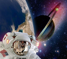 Wall Mural - astronaut helmet spaceman extraterrestrial saturn planet sci fi space travel. elements of this image