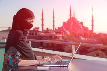 Wall Mural - Portrait of beautiful Arabian Woman working on Computer