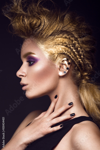 Daring Girl With A Mohawk Hairstyle Painted In Gold Punk