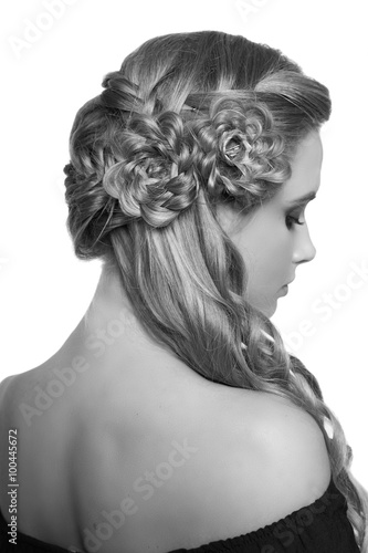 Obraz w ramie portrait of a beautiful young blonde woman on a light background with hairdo on her head. copy space.