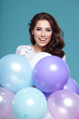 Sticker - Happy young woman with colorful latex balloons,