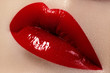 Close-up of female lips with bright makeup. Macro of woman's face. Fashion lip make-up with red gloss
