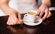 © satura_ - woman holding hot cup of coffee