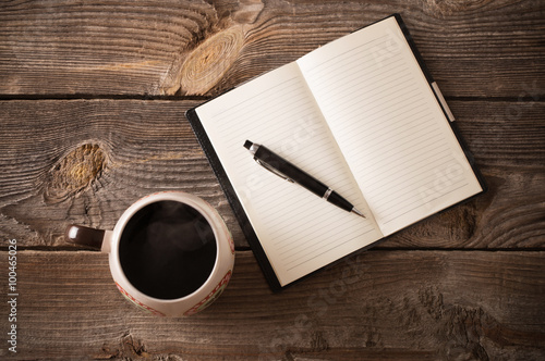 Fotografie, Tablou notebook with pen and coffee on old wooden table