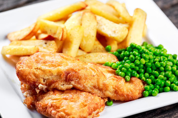 Wall Mural - British Traditional Fish and chips with peas