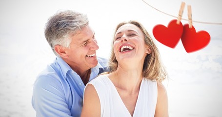 Composite image of happy couple laughing together