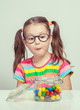 © Myst - beautiful cute little girl eating candy from candy jar