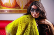 © FashionStock - Portrait of the alluring lady wearing sexy lingerie, fur coat and mask posing in the interior.