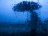 Fototapeta Młodzieżowe - rainny days blue silhouette - homem na chuva