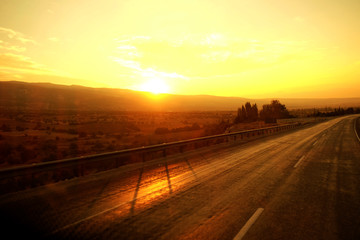 Poster - Beautiful golden sunrise over the road