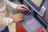 Fototapeta Zachód słońca - ATM - entering pin