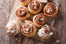 Cinnamon Rolls With Almond Close Up On The Table. Horizontal Top View 
