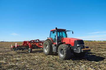 Poster - Red tractor in a field