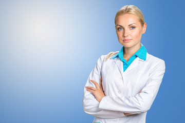 Wall Mural - Beautiful smiling doctor woman in medical gown