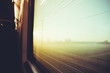 Blurred vintage filtered countryside view by a train window - tr