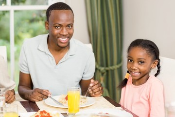 Happy family enjoying their meal