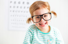Concept Vision Testing. Child  Girl With Eyeglasses
