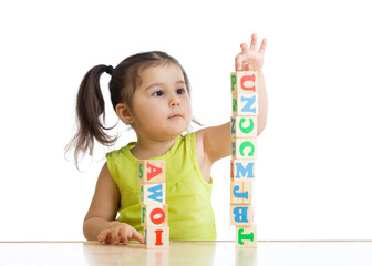 Fototapete - child little girl playing wooden toys 