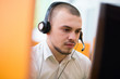 © Myvisuals - businessman with a headset portrait at bright call center helpde