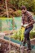 © Wavebreak Media - Man with a shovel gardening