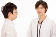 © imagesbykenny - Concerned Asian female doctor with patient