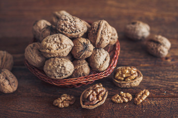 Canvas Print - Walnuts on wooden background