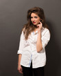© Svyatoslav Lypynskyy - Beautiful lady in white shirt in studio