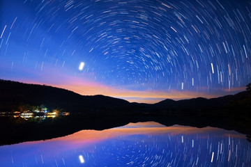 Wall Mural - night sky, star trails and reflect