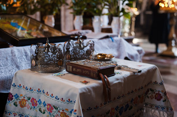 luxury golden crowns with stones for the wedding ceremony in the old church