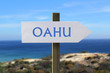 Oahu sign with seashore in the background