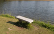 © 88studio - bench at the waterside of the pond