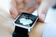 © Syda Productions - close up of hands with weather icon on smartwatch