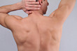Male Waxing. Muscular male body hair removal close up.