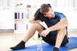 Athletic Man Resting After his Indoor Exercise