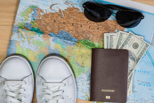 Shoes, Passport, Cash, Sunglasses And Map