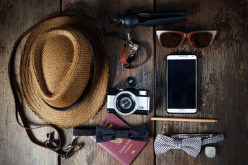 Wall Mural - Shoe hat and accessories travel set on a wooden background